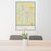 24x36 Americus Georgia Map Print Portrait Orientation in Woodblock Style Behind 2 Chairs Table and Potted Plant