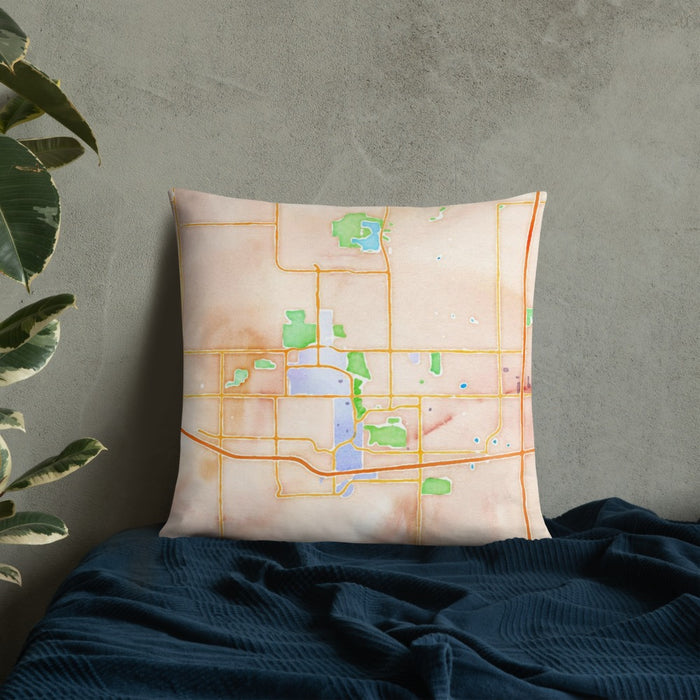 Custom Ames Iowa Map Throw Pillow in Watercolor on Bedding Against Wall