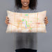 Person holding 20x12 Custom Ames Iowa Map Throw Pillow in Watercolor