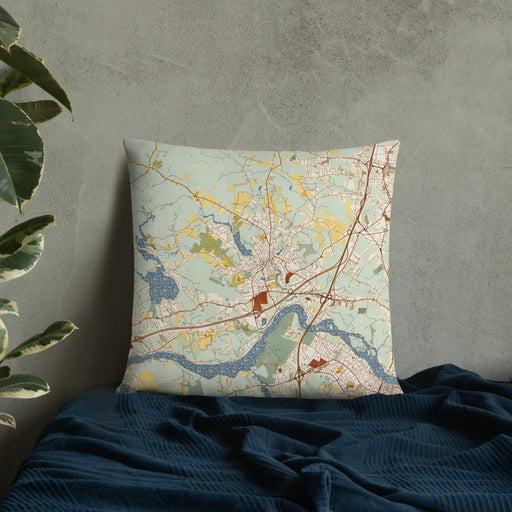 Custom Amesbury Massachusetts Map Throw Pillow in Woodblock on Bedding Against Wall