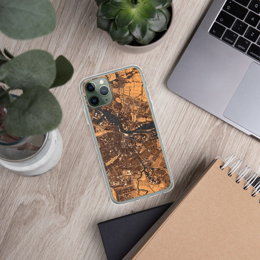 Custom Amsterdam Netherlands Map Phone Case in Ember on Table with Laptop and Plant