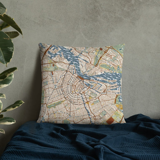 Custom Amsterdam Netherlands Map Throw Pillow in Woodblock on Bedding Against Wall