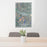 24x36 Anaconda Montana Map Print Portrait Orientation in Afternoon Style Behind 2 Chairs Table and Potted Plant