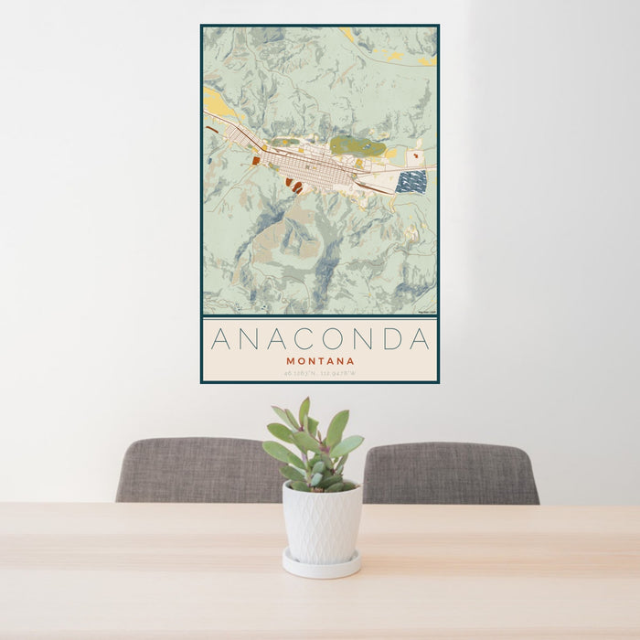 24x36 Anaconda Montana Map Print Portrait Orientation in Woodblock Style Behind 2 Chairs Table and Potted Plant