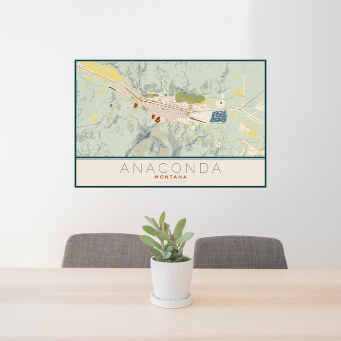 24x36 Anaconda Montana Map Print Landscape Orientation in Woodblock Style Behind 2 Chairs Table and Potted Plant