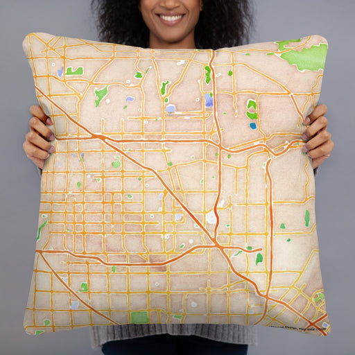 Person holding 22x22 Custom Anaheim California Map Throw Pillow in Watercolor