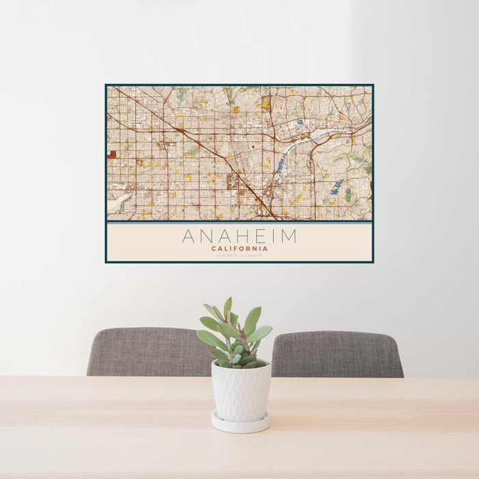 24x36 Anaheim California Map Print Landscape Orientation in Woodblock Style Behind 2 Chairs Table and Potted Plant