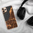 Custom Anchorage Alaska Map Phone Case in Ember on Table with Black Headphones