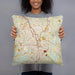 Person holding 18x18 Custom Anderson South Carolina Map Throw Pillow in Woodblock