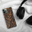 Custom Andes New York Map Phone Case in Ember on Table with Black Headphones