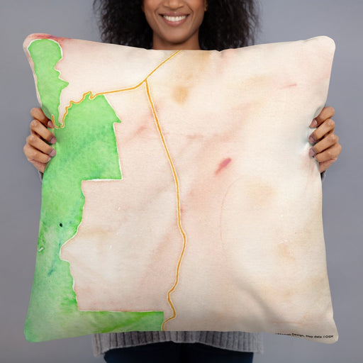 Person holding 22x22 Custom Angel Fire New Mexico Map Throw Pillow in Watercolor