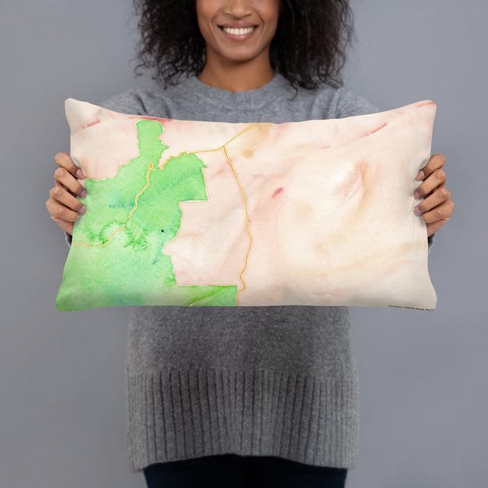 Person holding 20x12 Custom Angel Fire New Mexico Map Throw Pillow in Watercolor