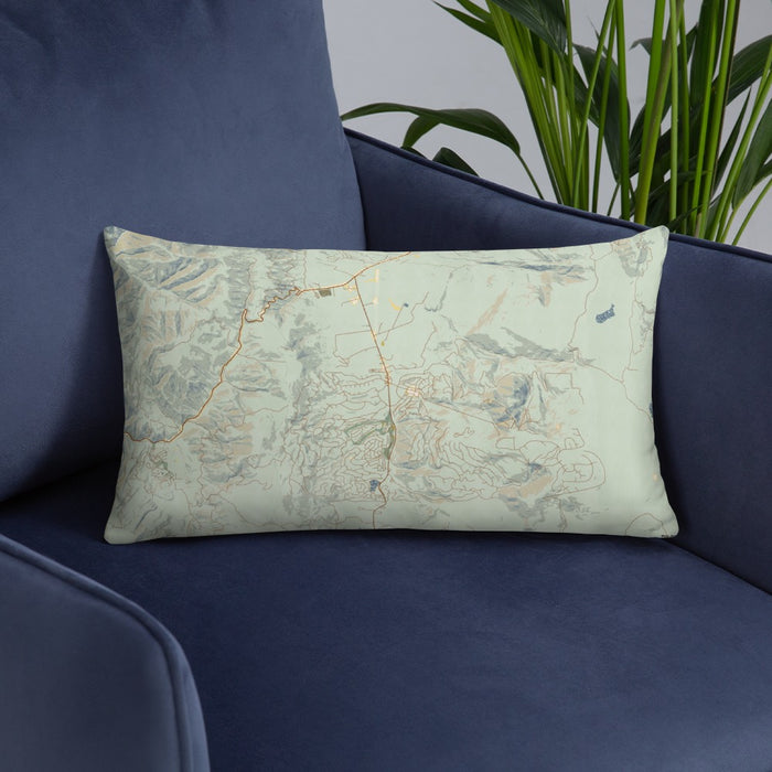 Custom Angel Fire New Mexico Map Throw Pillow in Woodblock on Blue Colored Chair