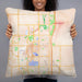 Person holding 22x22 Custom Ankeny Iowa Map Throw Pillow in Watercolor