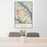 24x36 Annapolis Maryland Map Print Portrait Orientation in Woodblock Style Behind 2 Chairs Table and Potted Plant
