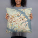 Person holding 18x18 Custom Annapolis Maryland Map Throw Pillow in Woodblock