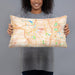 Person holding 20x12 Custom Ann Arbor Michigan Map Throw Pillow in Watercolor