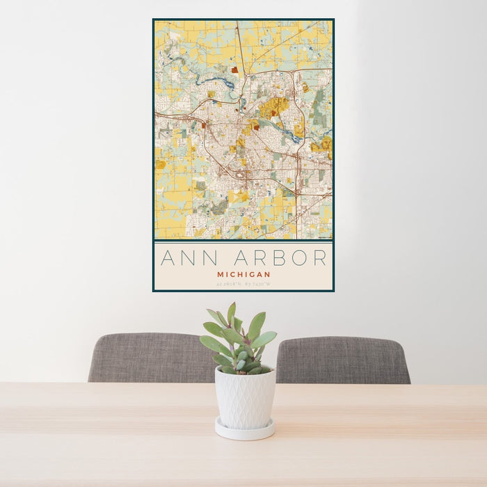 24x36 Ann Arbor Michigan Map Print Portrait Orientation in Woodblock Style Behind 2 Chairs Table and Potted Plant