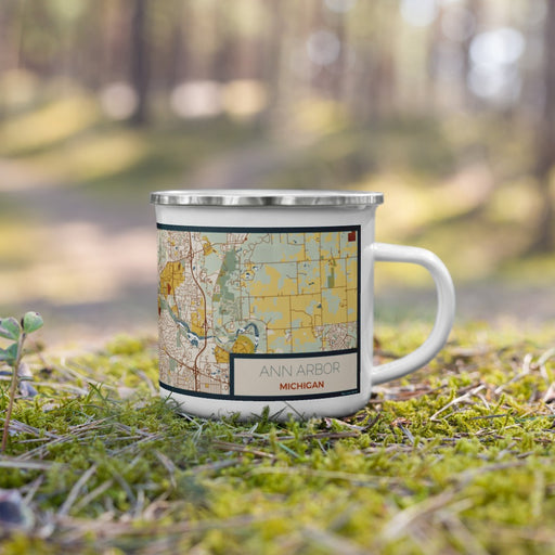 Right View Custom Ann Arbor Michigan Map Enamel Mug in Woodblock on Grass With Trees in Background
