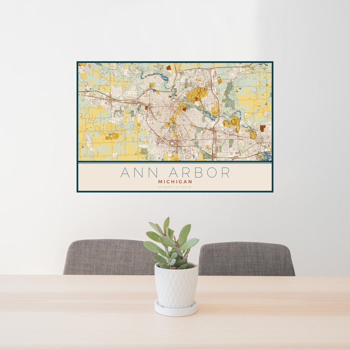 24x36 Ann Arbor Michigan Map Print Landscape Orientation in Woodblock Style Behind 2 Chairs Table and Potted Plant