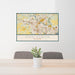 24x36 Ann Arbor Michigan Map Print Landscape Orientation in Woodblock Style Behind 2 Chairs Table and Potted Plant