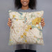 Person holding 18x18 Custom Ann Arbor Michigan Map Throw Pillow in Woodblock