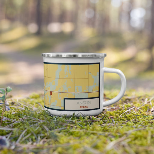 Right View Custom Anson Texas Map Enamel Mug in Woodblock on Grass With Trees in Background