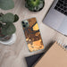 Custom Antioch California Map Phone Case in Ember on Table with Laptop and Plant