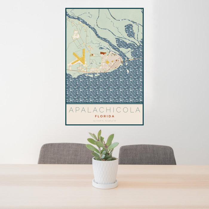 24x36 Apalachicola Florida Map Print Portrait Orientation in Woodblock Style Behind 2 Chairs Table and Potted Plant