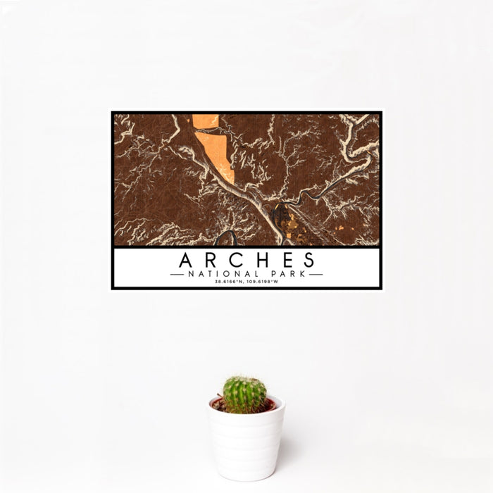 12x18 Arches National Park Map Print Landscape Orientation in Ember Style With Small Cactus Plant in White Planter