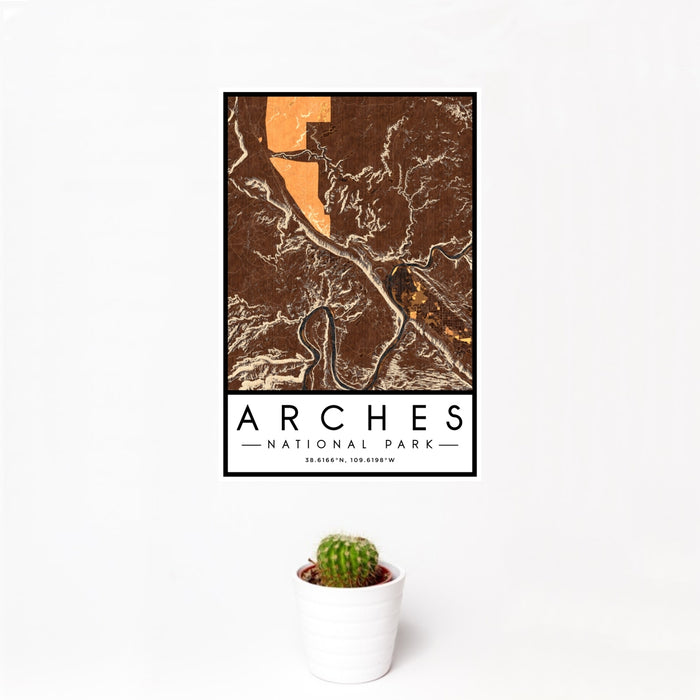 12x18 Arches National Park Map Print Portrait Orientation in Ember Style With Small Cactus Plant in White Planter