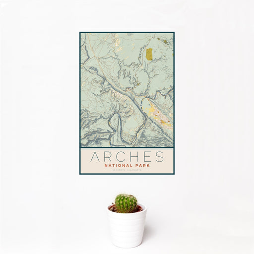 12x18 Arches National Park Map Print Portrait Orientation in Woodblock Style With Small Cactus Plant in White Planter