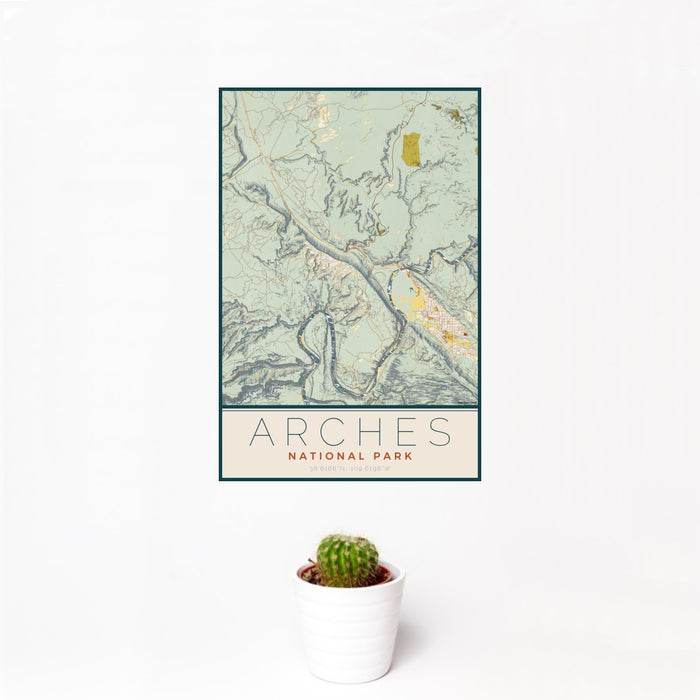 12x18 Arches National Park Map Print Portrait Orientation in Woodblock Style With Small Cactus Plant in White Planter