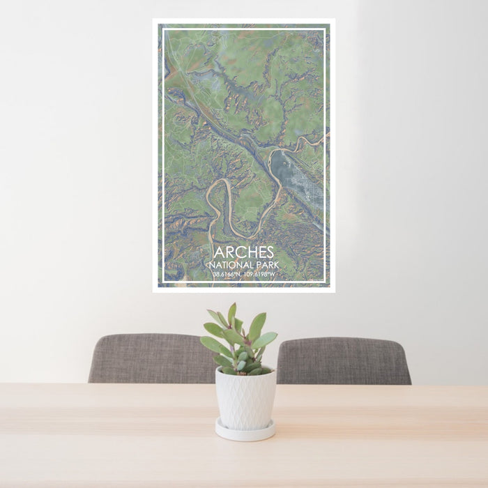 24x36 Arches National Park Map Print Portrait Orientation in Afternoon Style Behind 2 Chairs Table and Potted Plant