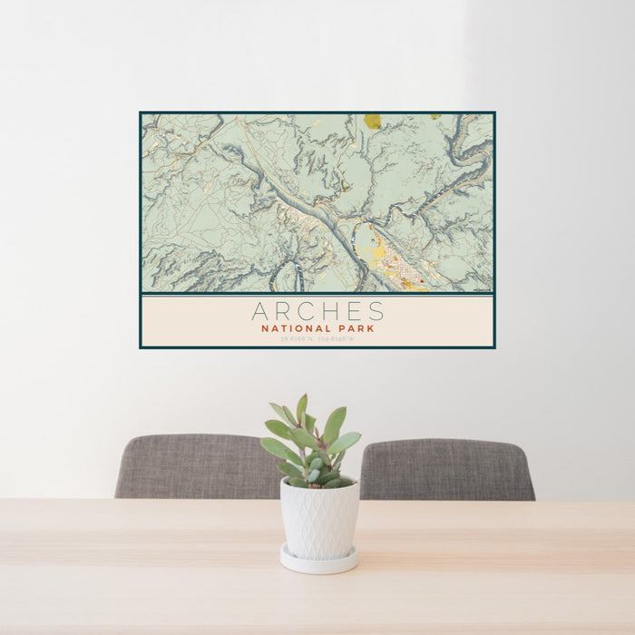 24x36 Arches National Park Map Print Lanscape Orientation in Woodblock Style Behind 2 Chairs Table and Potted Plant