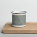 Front View Custom Arches National Park Map Enamel Mug in Afternoon on Cutting Board