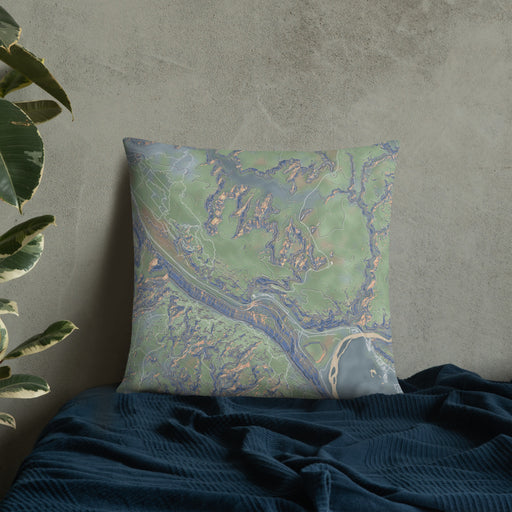 Custom Arches National Park Map Throw Pillow in Afternoon on Bedding Against Wall