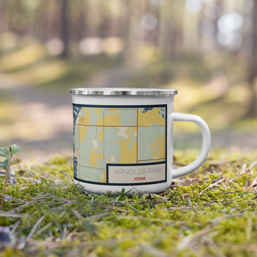 Right View Custom Arnolds Park Iowa Map Enamel Mug in Woodblock on Grass With Trees in Background
