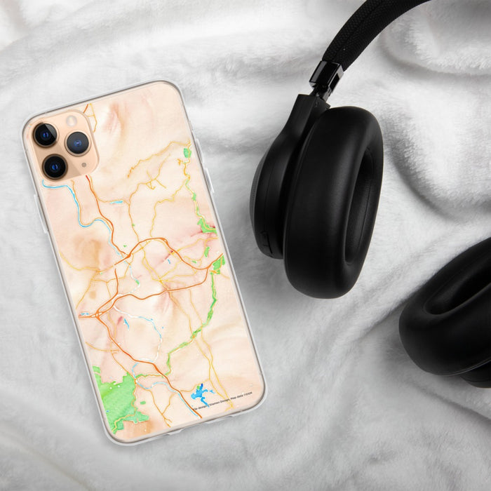 Custom Asheville North Carolina Map Phone Case in Watercolor on Table with Black Headphones