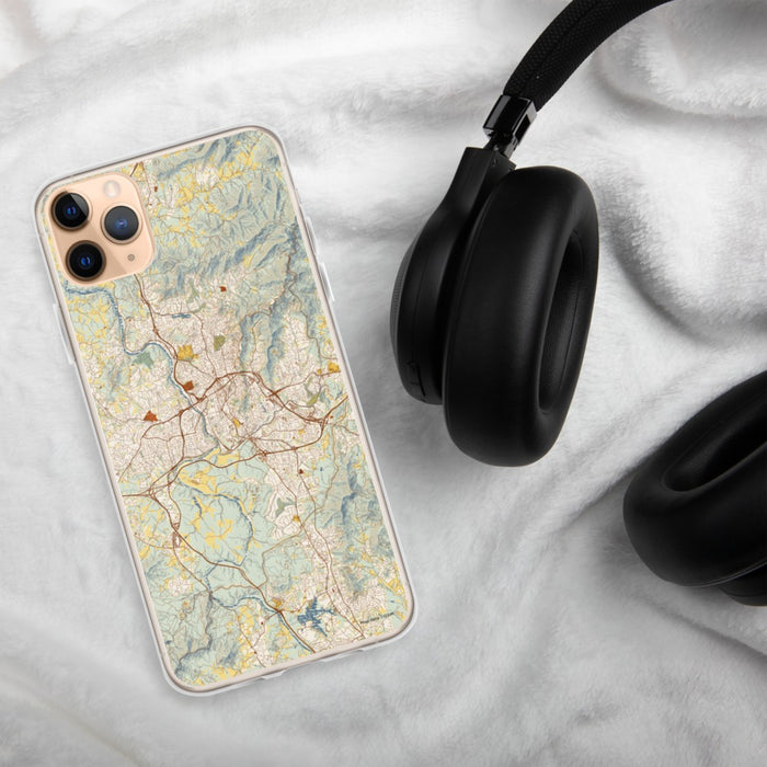 Custom Asheville North Carolina Map Phone Case in Woodblock on Table with Black Headphones