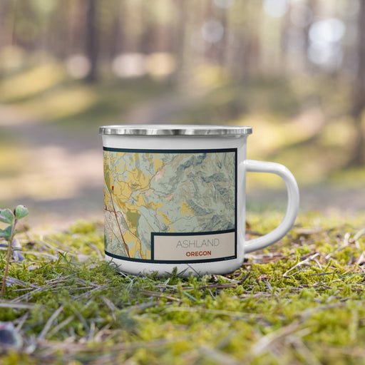 Right View Custom Ashland Oregon Map Enamel Mug in Woodblock on Grass With Trees in Background
