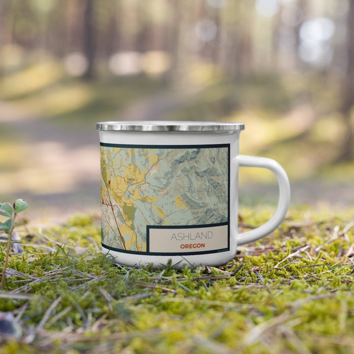 Right View Custom Ashland Oregon Map Enamel Mug in Woodblock on Grass With Trees in Background