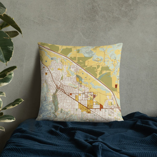 Custom Ashland Oregon Map Throw Pillow in Woodblock on Bedding Against Wall