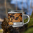 Right View Custom Ashland Wisconsin Map Enamel Mug in Ember on Grass With Trees in Background