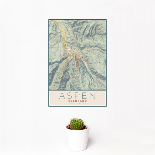 12x18 Aspen Colorado Map Print Portrait Orientation in Woodblock Style With Small Cactus Plant in White Planter