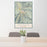 24x36 Aspen Colorado Map Print Portrait Orientation in Woodblock Style Behind 2 Chairs Table and Potted Plant