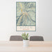24x36 Aspen Colorado Map Print Portrait Orientation in Woodblock Style Behind 2 Chairs Table and Potted Plant