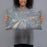 Person holding 20x12 Custom Aspen Colorado Map Throw Pillow in Afternoon