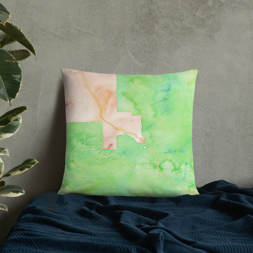 Custom Aspen Colorado Map Throw Pillow in Watercolor on Bedding Against Wall