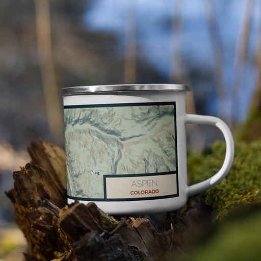 Right View Custom Aspen Colorado Map Enamel Mug in Woodblock on Grass With Trees in Background
